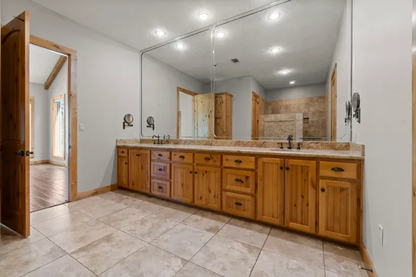 a large kitchen with a large window and stainless steel appliances