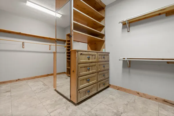 a view of a hall with wooden floor