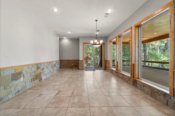 a living room with granite countertop furniture and fireplace