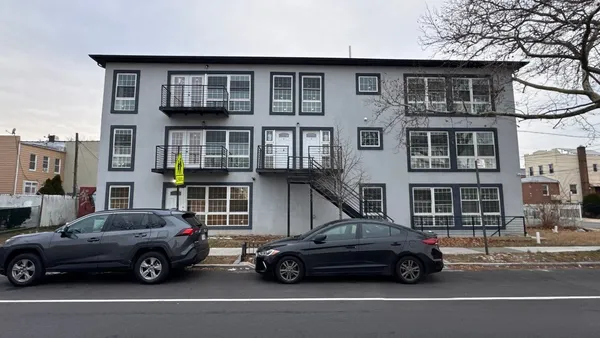 a car parked in front of a house