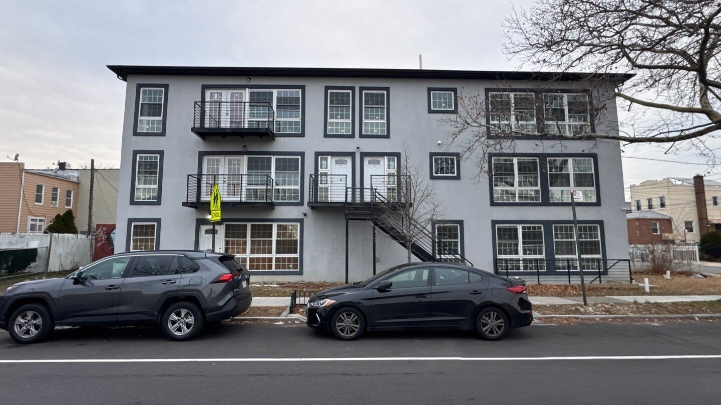 a car parked in front of a house