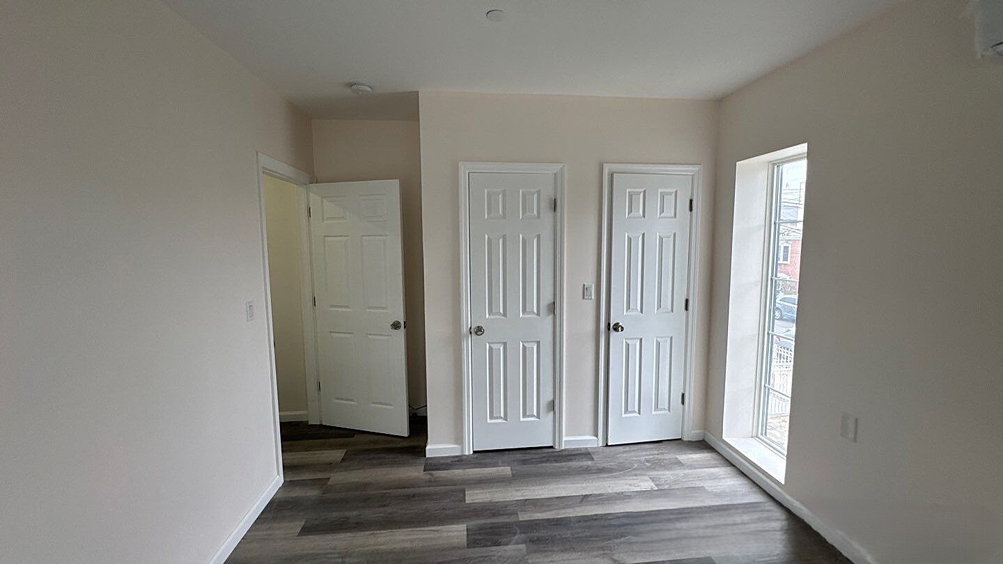 830 Hendrix Street Brooklyn, NY 11207 - Photo 14 of 25 a view of a hallway with wooden floor