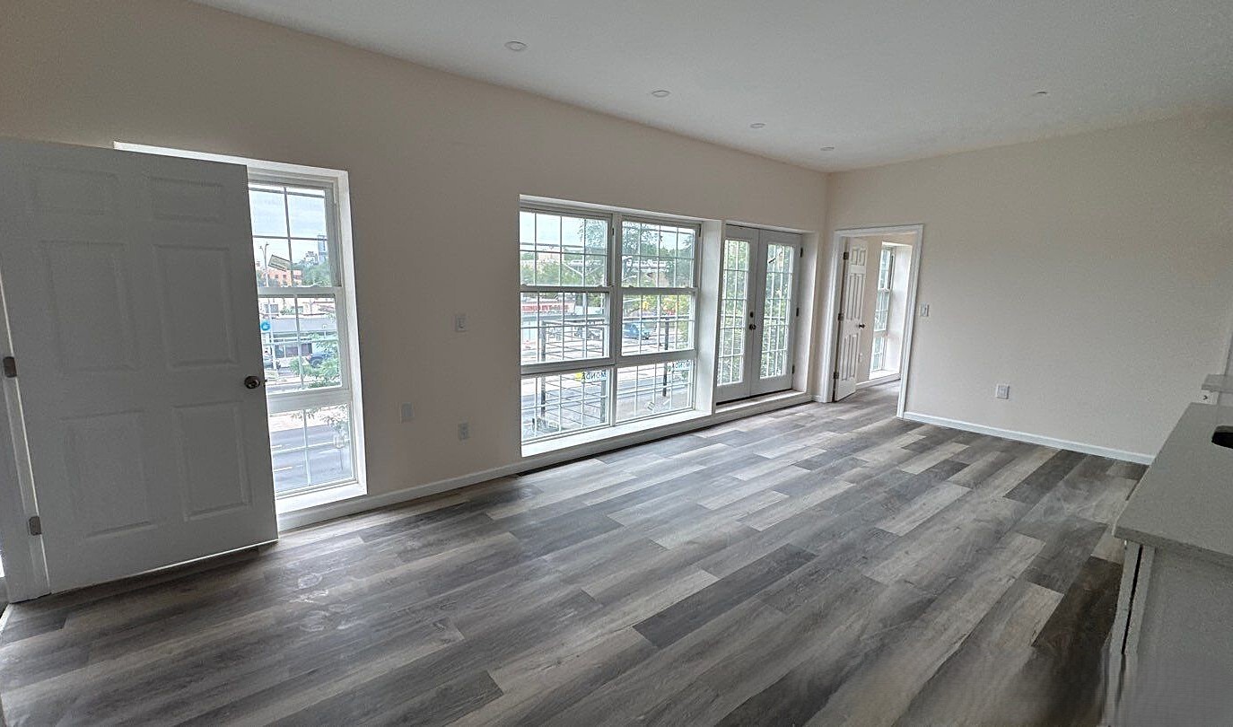 830 Hendrix Street Brooklyn, NY 11207 - Photo 17 of 25 a view of an empty room with wooden floor and a window