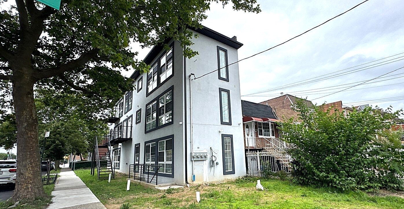 830 Hendrix Street Brooklyn, NY 11207 - Photo 3 of 25 a front view of a house with a yard