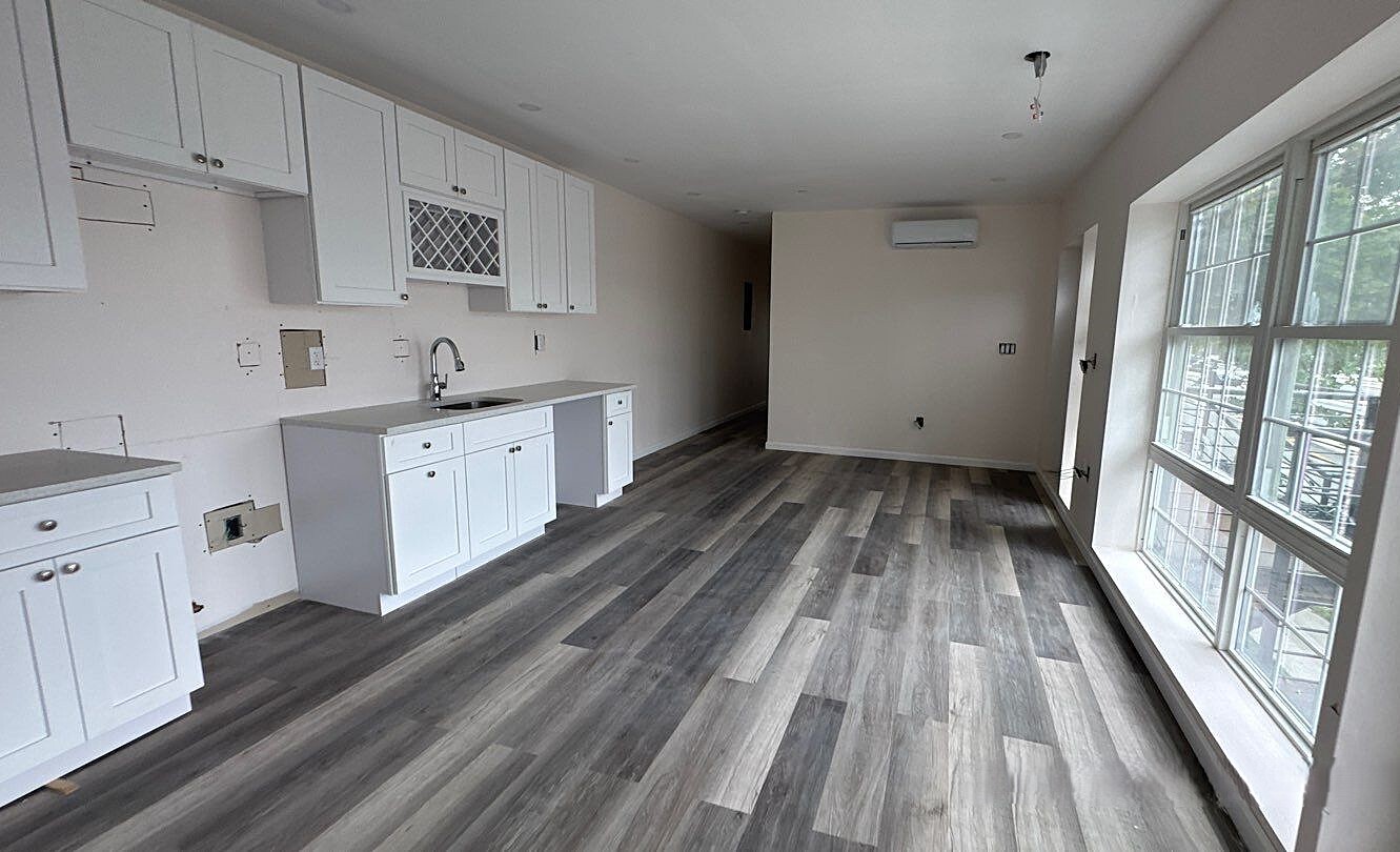 830 Hendrix Street Brooklyn, NY 11207 - Photo 9 of 25 a view of kitchen with wooden floor and electronic appliances