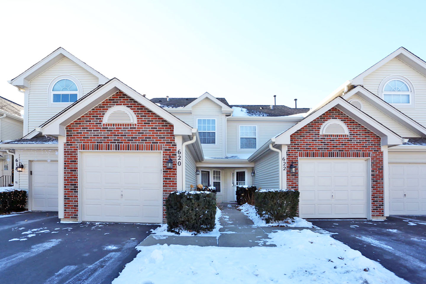 620 Cobblestone Court, Unit 620 Elgin, IL 60120 - Photo 1 of 25 a front view of a house with yard