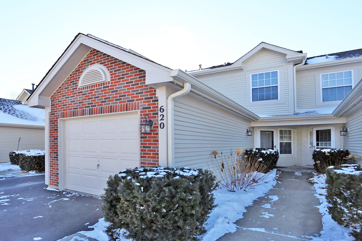 620 Cobblestone Court, Unit 620 Elgin, IL 60120 - Photo 3 of 25 a front view of house with yard and seating area