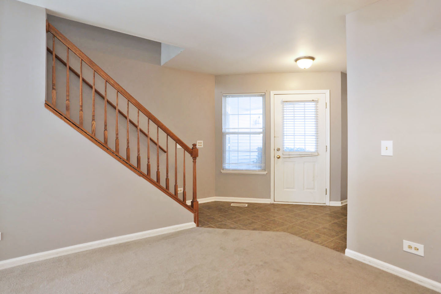 620 Cobblestone Court, Unit 620 Elgin, IL 60120 - Photo 5 of 25 a view of an empty room with stairs