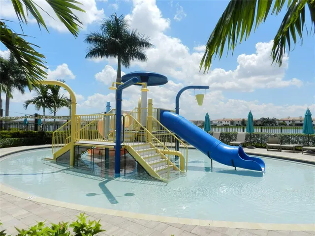 a view of a swimming pool with a lounge chair