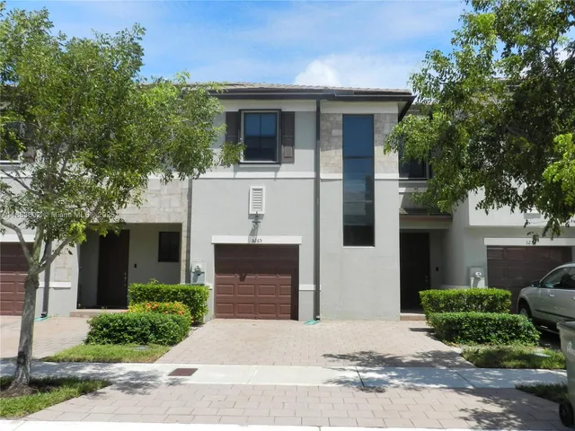 a front view of a house with yard