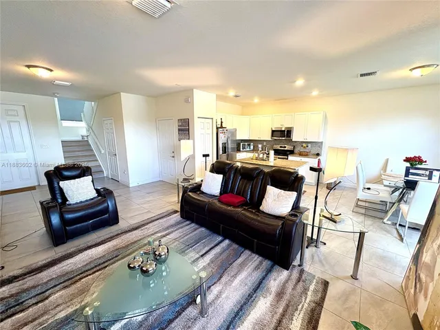 a living room with furniture and a table