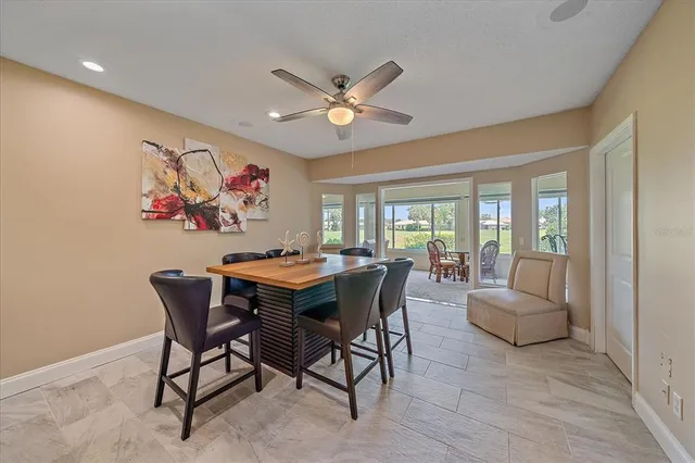 a dining room with furniture and window