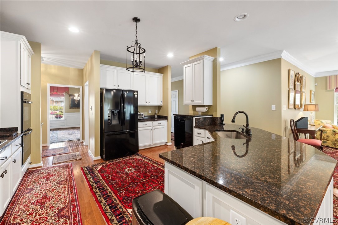 168 Button Bush Road Richmond, VA 23238 - Photo 12 of 42 a kitchen with granite countertop kitchen island stainless steel appliances a refrigerator sink and stove
