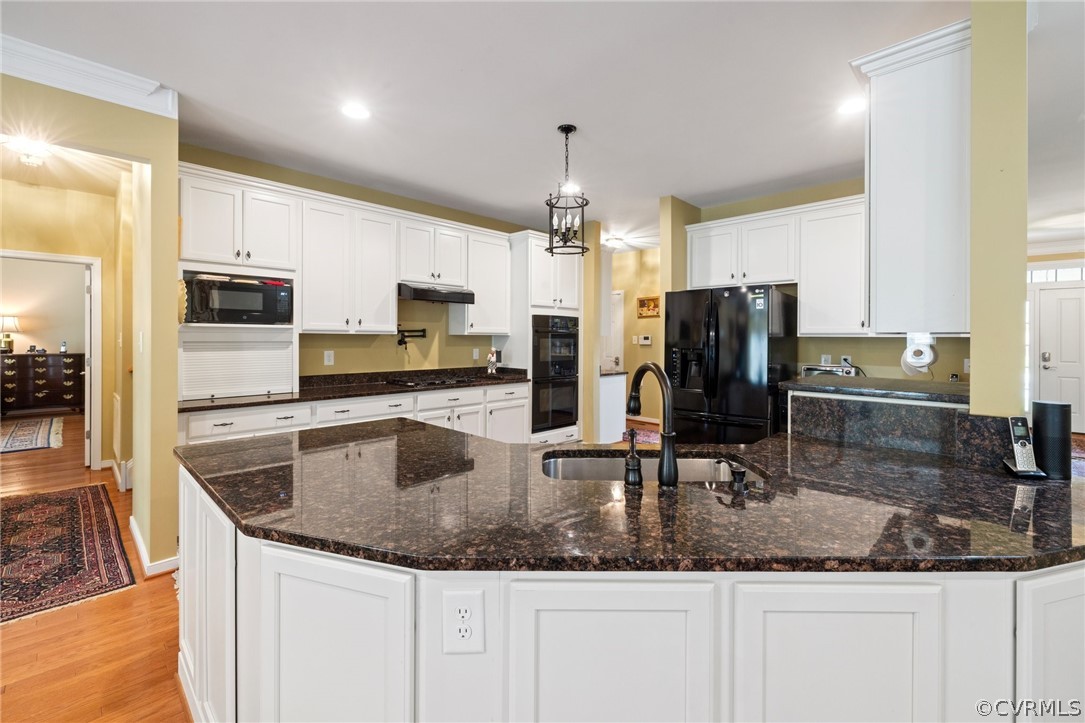 168 Button Bush Road Richmond, VA 23238 - Photo 13 of 42 a kitchen with granite countertop a sink a counter top space appliances and cabinets