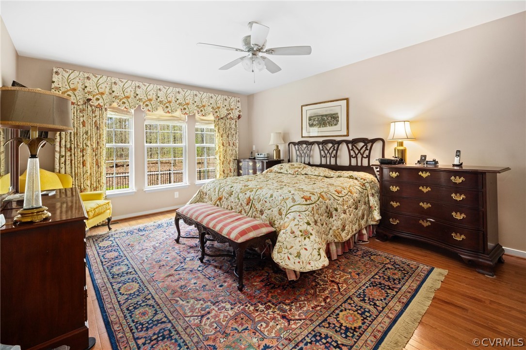 168 Button Bush Road Richmond, VA 23238 - Photo 22 of 42 a bedroom with a bed a dresser and a large window