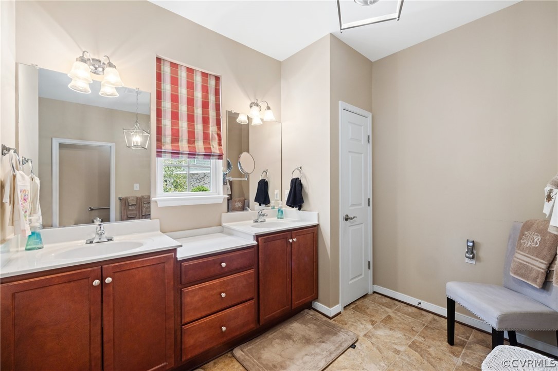 168 Button Bush Road Richmond, VA 23238 - Photo 25 of 42 a bathroom with a sink and a mirror