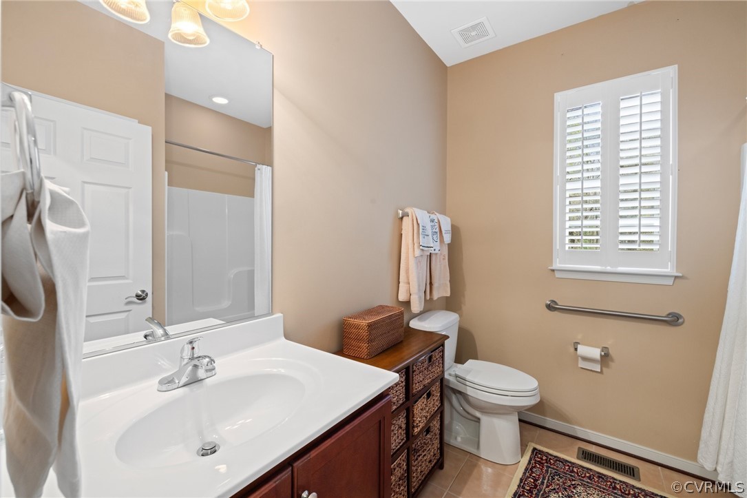 168 Button Bush Road Richmond, VA 23238 - Photo 27 of 42 a bathroom with a toilet sink and mirror