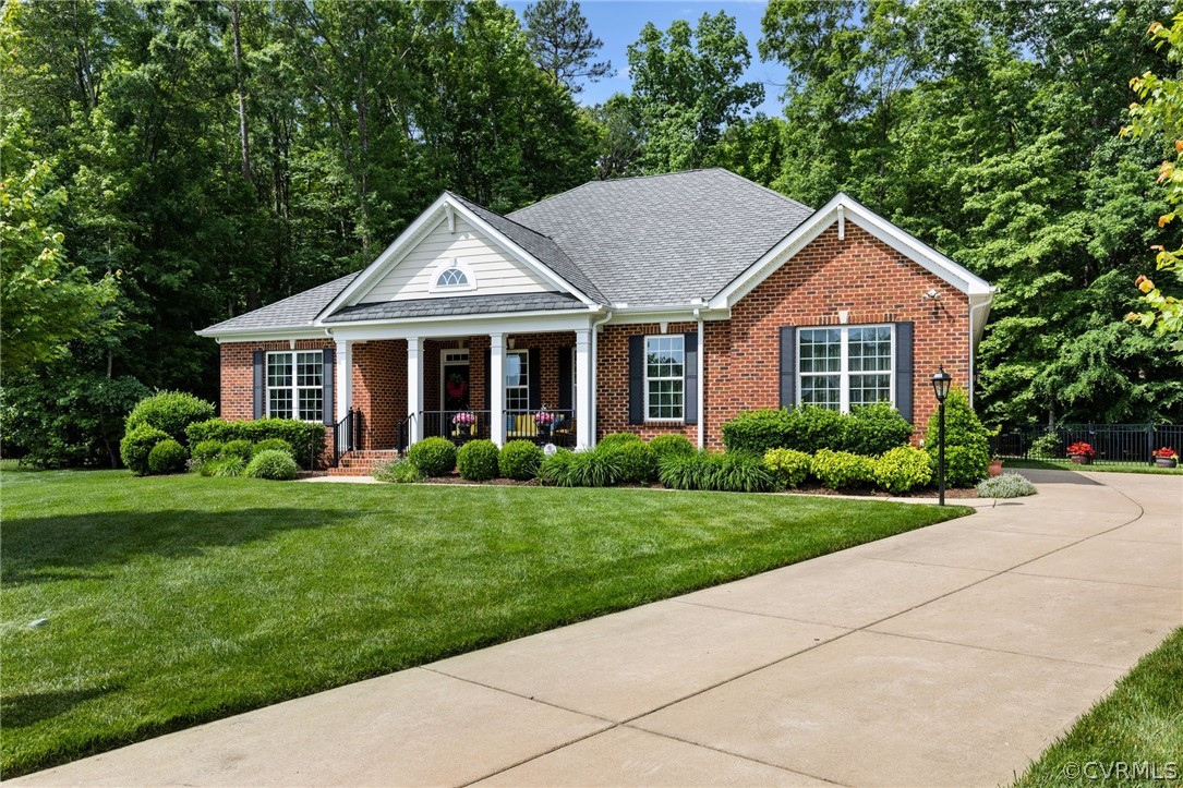 168 Button Bush Road Richmond, VA 23238 - Photo 3 of 42 a front view of a house with a yard