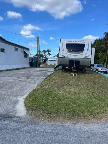 a view of a backyard with furniture