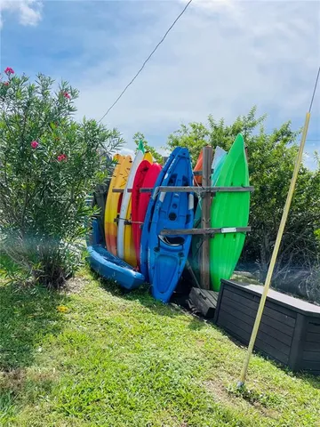 a view of a backyard with sitting area