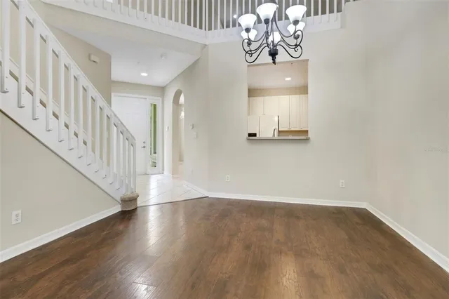 a view of an entryway with wooden floor