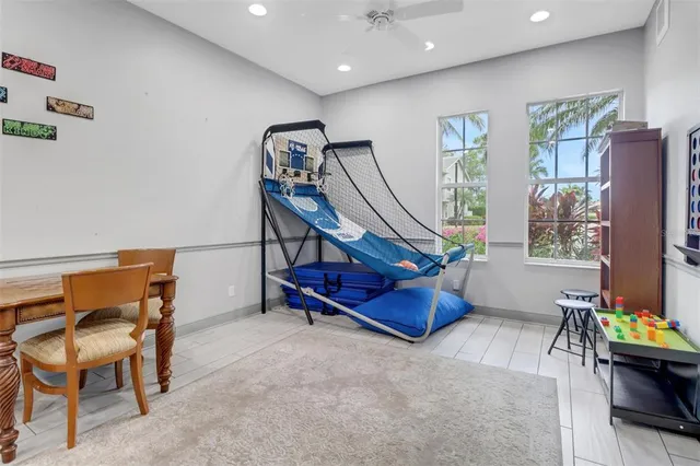 a bedroom with furniture and a gym machine