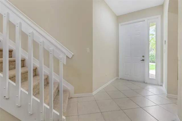 a view of an entryway with wooden floor