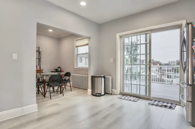 a view of a livingroom with furniture and a window