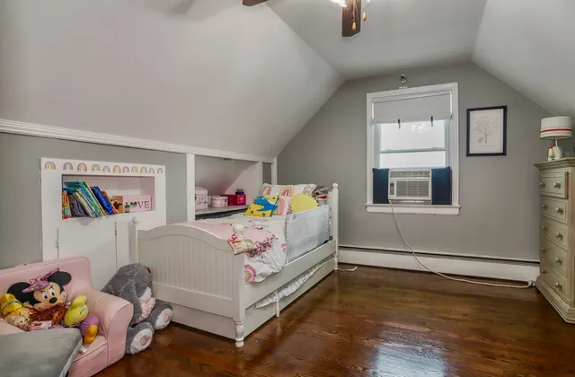 a bedroom with furniture and a bed