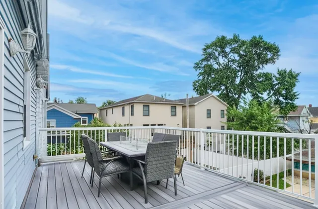 a view of a deck with furniture and a deck