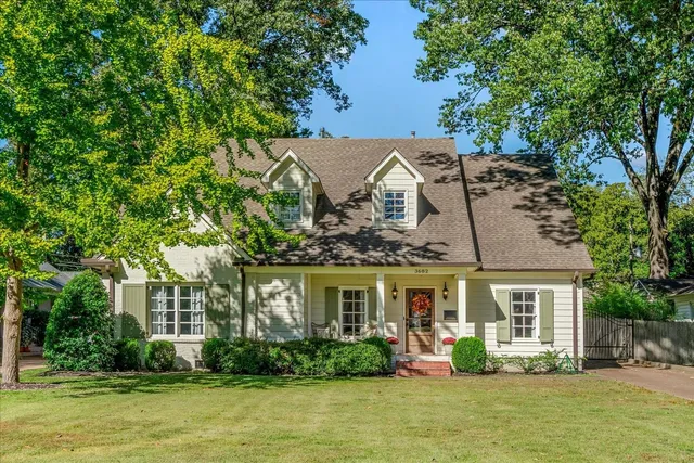 front view of a house with a large garden