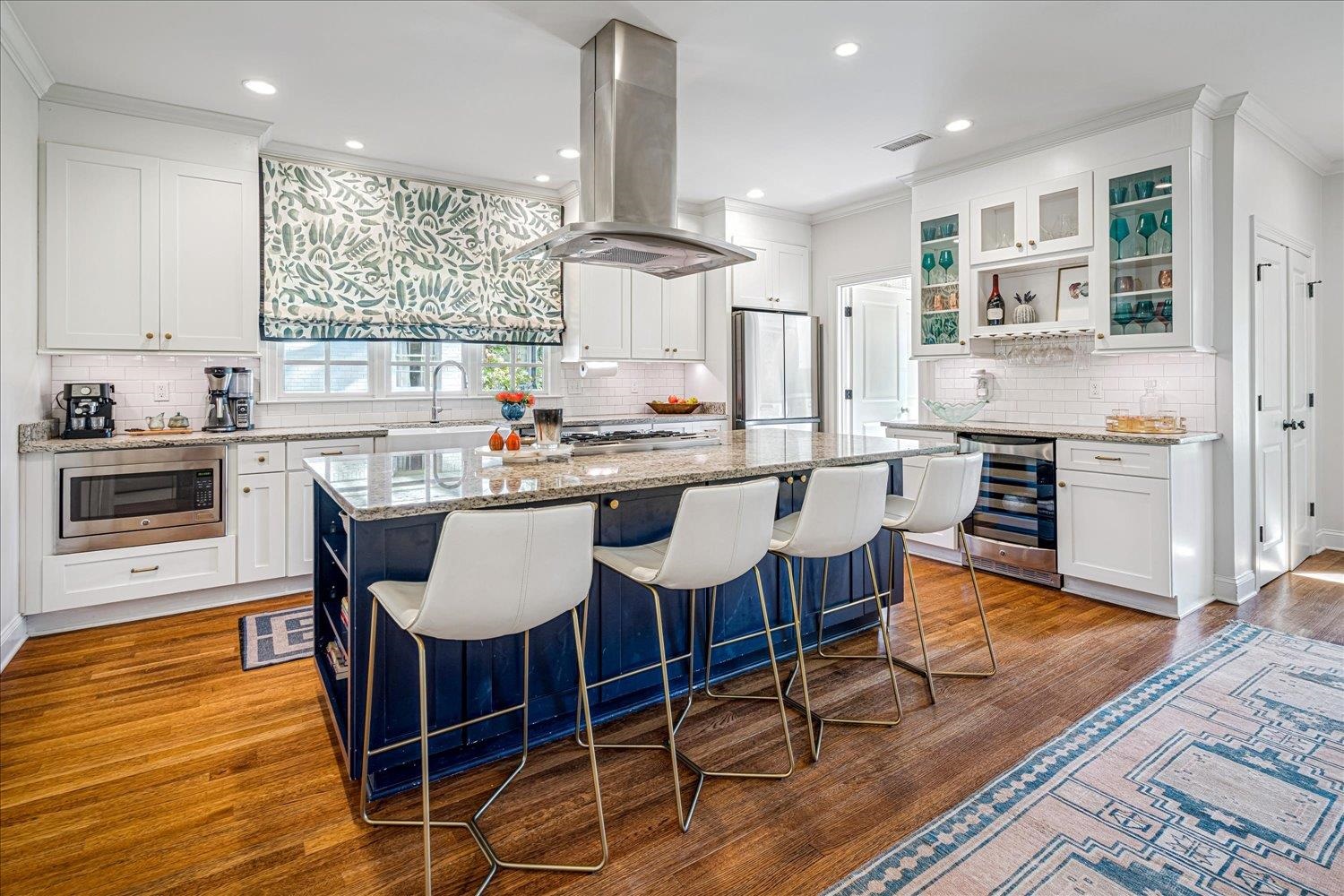 3682 Oakley Avenue Memphis, TN 38111 - Photo 13 of 34 a kitchen with stainless steel appliances a dining table chairs sink and cabinets