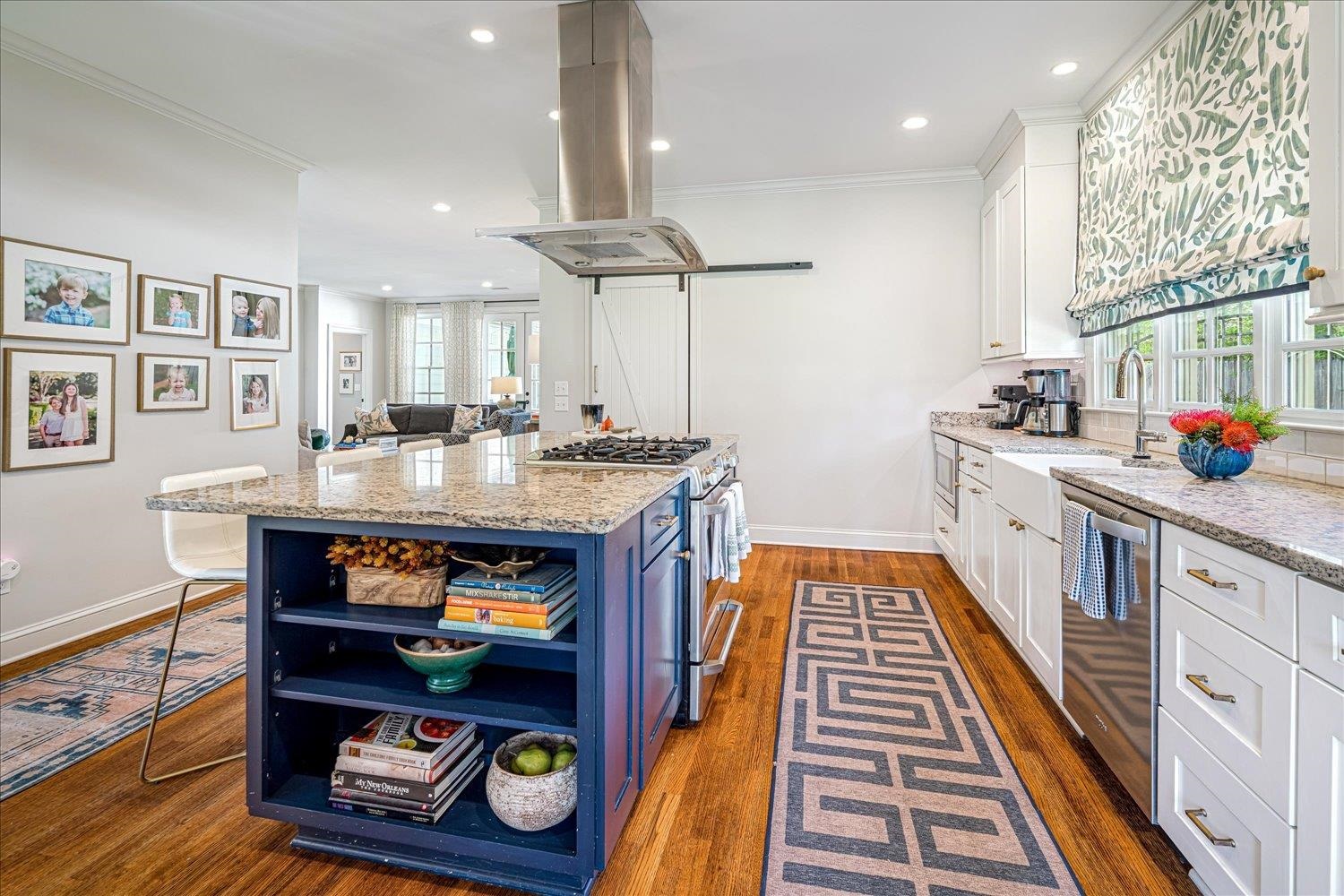 3682 Oakley Avenue Memphis, TN 38111 - Photo 16 of 34 a kitchen with stainless steel appliances a stove a refrigerator and cabinets