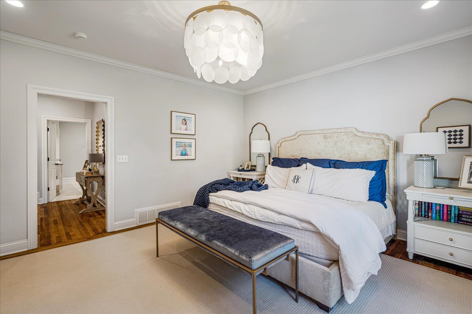 3682 Oakley Avenue Memphis, TN 38111 - Photo 21 of 34 a bedroom with a bed and a chandelier