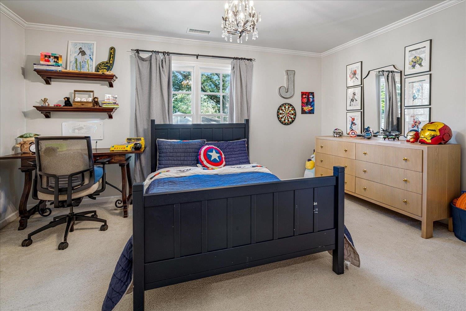 3682 Oakley Avenue Memphis, TN 38111 - Photo 27 of 34 a bedroom with a bed and a chandelier