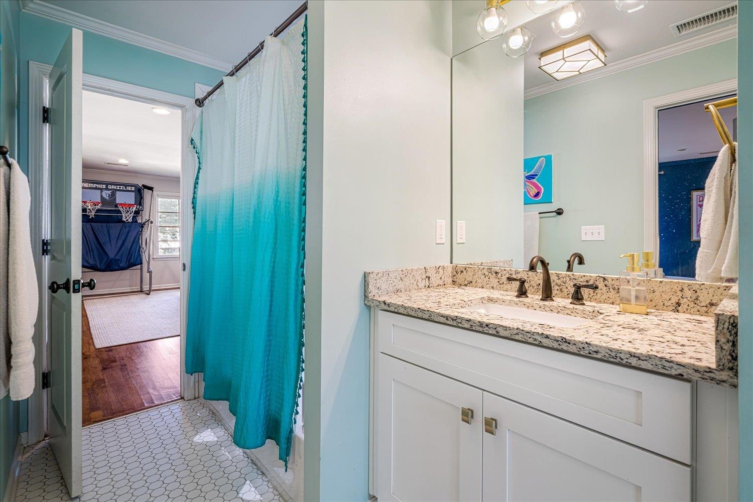 3682 Oakley Avenue Memphis, TN 38111 - Photo 30 of 34 a bathroom with a granite countertop sink and a mirror