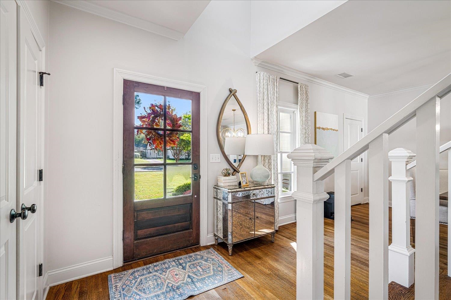 3682 Oakley Avenue Memphis, TN 38111 - Photo 5 of 34 a living room with furniture a rug and a chandelier