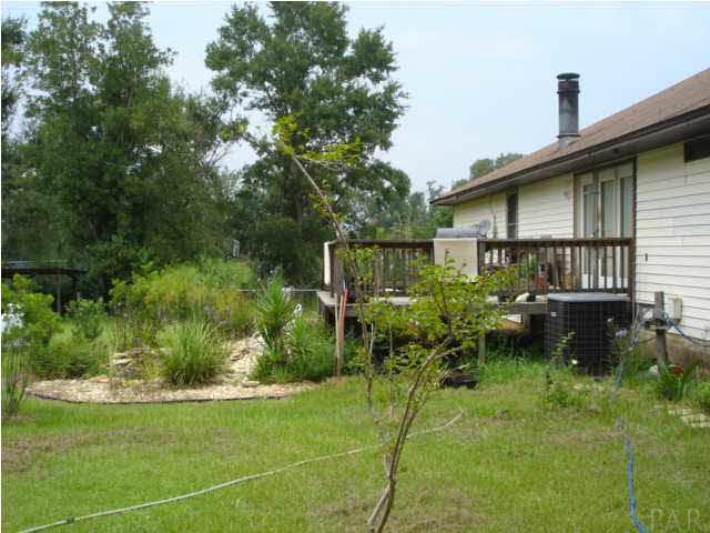 1085 Tate Road Cantonment, FL 32533 - Photo 13 of 19 Great deck for entertaining and enjoying the view of backyard.