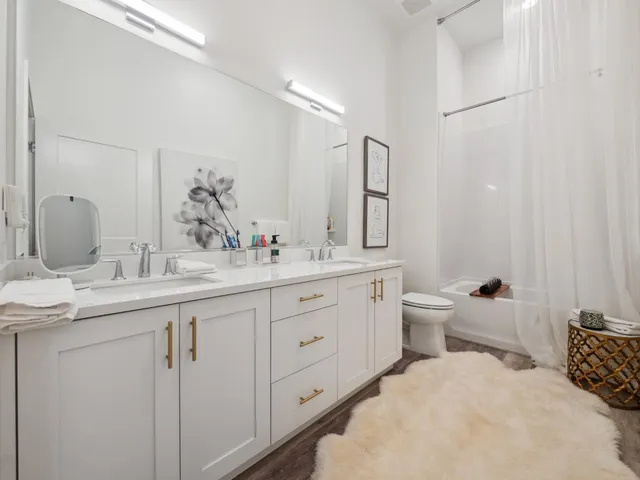 a bathroom with a granite countertop sink mirror and a