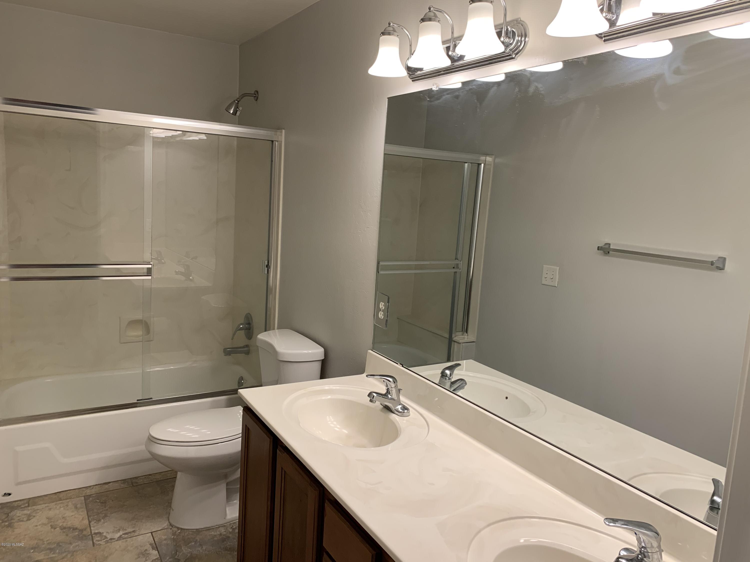 4181 North Fortune Loop Tucson, AZ 85719 - Photo 15 of 39 a bathroom with a sink toilet and shower