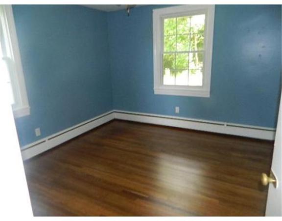 37 Arnold Road Sturbridge, MA 01518 - Photo 11 of 21 an empty room with wooden floor and windows