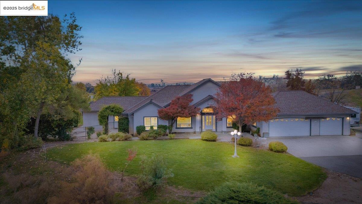 10200 Bell Mooney Road Jamestown, CA 95327 - Photo 1 of 60 a front view of a house with a yard