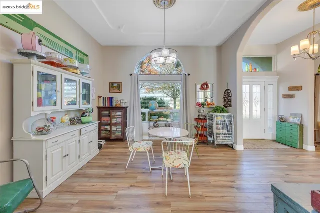a view of kitchen with stainless steel appliances refrigerator stove microwave and cabinets