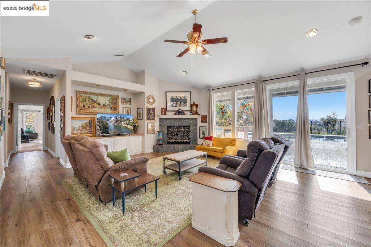 10200 Bell Mooney Road Jamestown, CA 95327 - Photo 12 of 60 a living room with fireplace furniture and a wooden floor