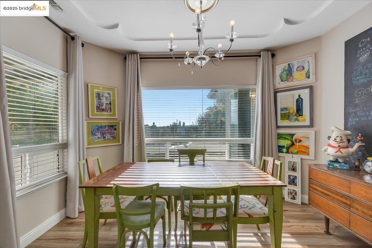 10200 Bell Mooney Road Jamestown, CA 95327 - Photo 22 of 60 a view of a dining room with furniture window and wooden floor
