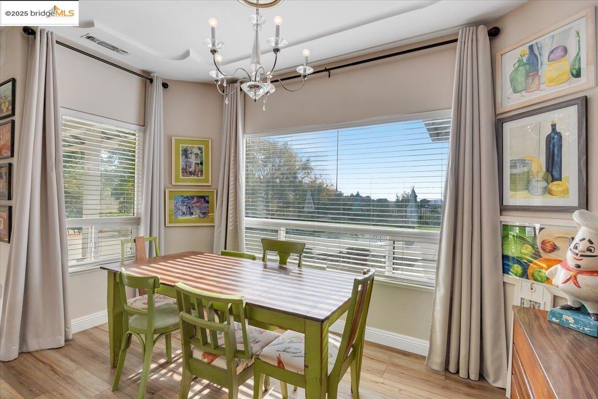 10200 Bell Mooney Road Jamestown, CA 95327 - Photo 23 of 60 a view of a dining room with furniture window and wooden floor