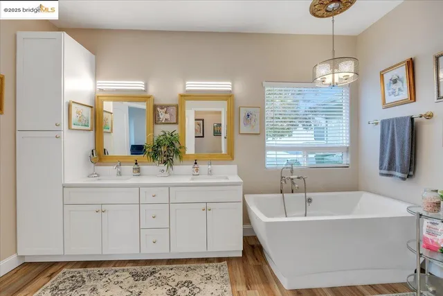 a view of a hallway with a livingroom and furniture