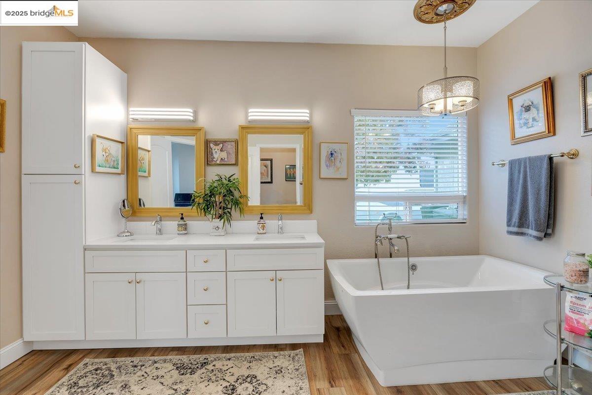 10200 Bell Mooney Road Jamestown, CA 95327 - Photo 28 of 60 a bathroom with a tub sink and mirror