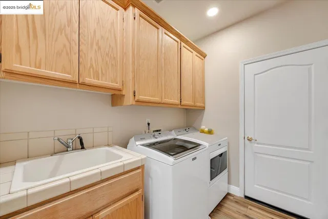 a bedroom with a bed and a flat tv screen on dresser