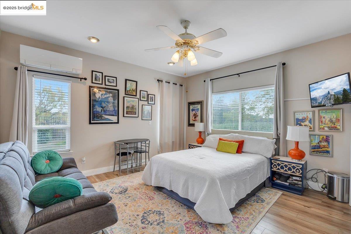 10200 Bell Mooney Road Jamestown, CA 95327 - Photo 37 of 60 a bedroom with a bed a couch and a window